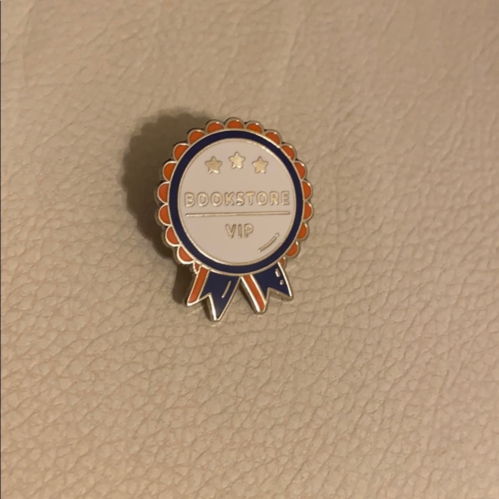 Slyfur Orange, Blue, and White Bookstore VIP Pin